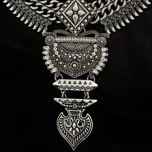 Ornate silver necklace. Costume